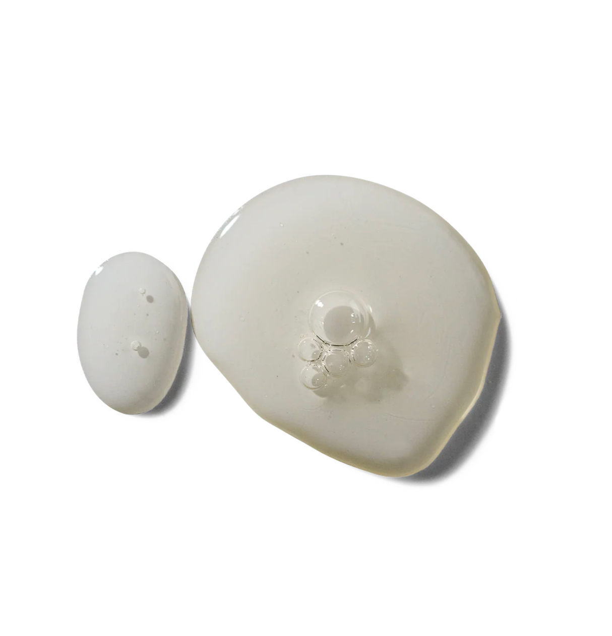 Two white ceramic items on a white background