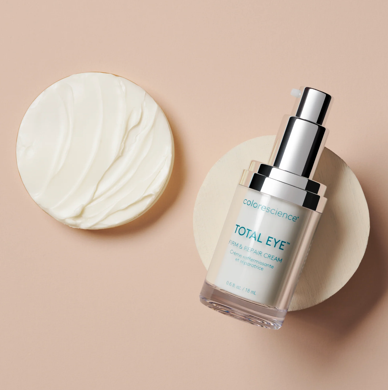 Cosmetic bottle labeled 'Total Eye' with a round applicator on a beige background