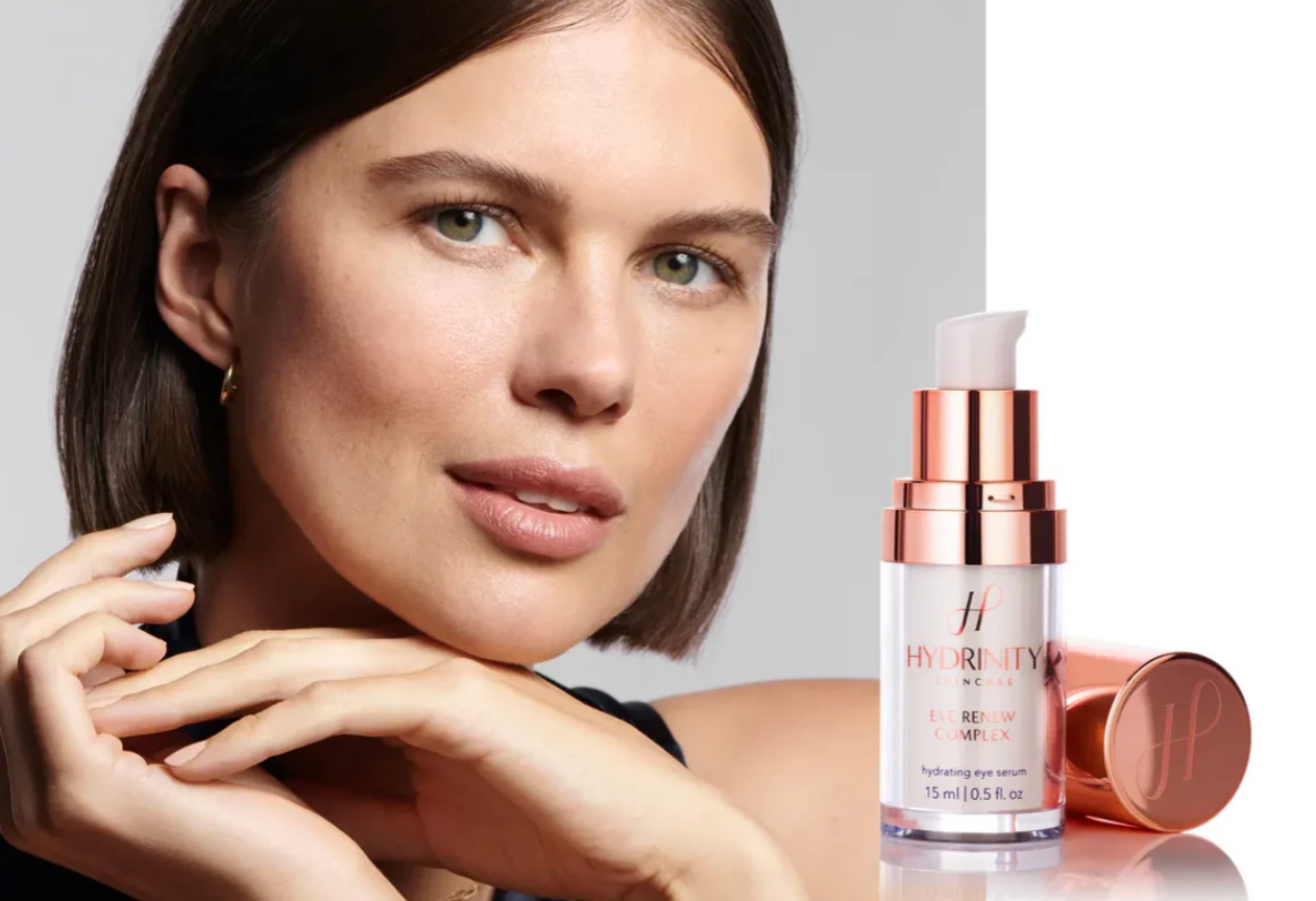 Woman with a skincare product on a reflective surface