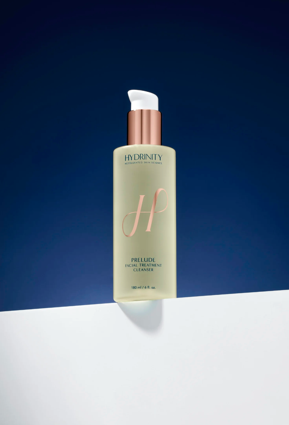 Skincare bottle with 'Hydrinity' branding on a blue and white background