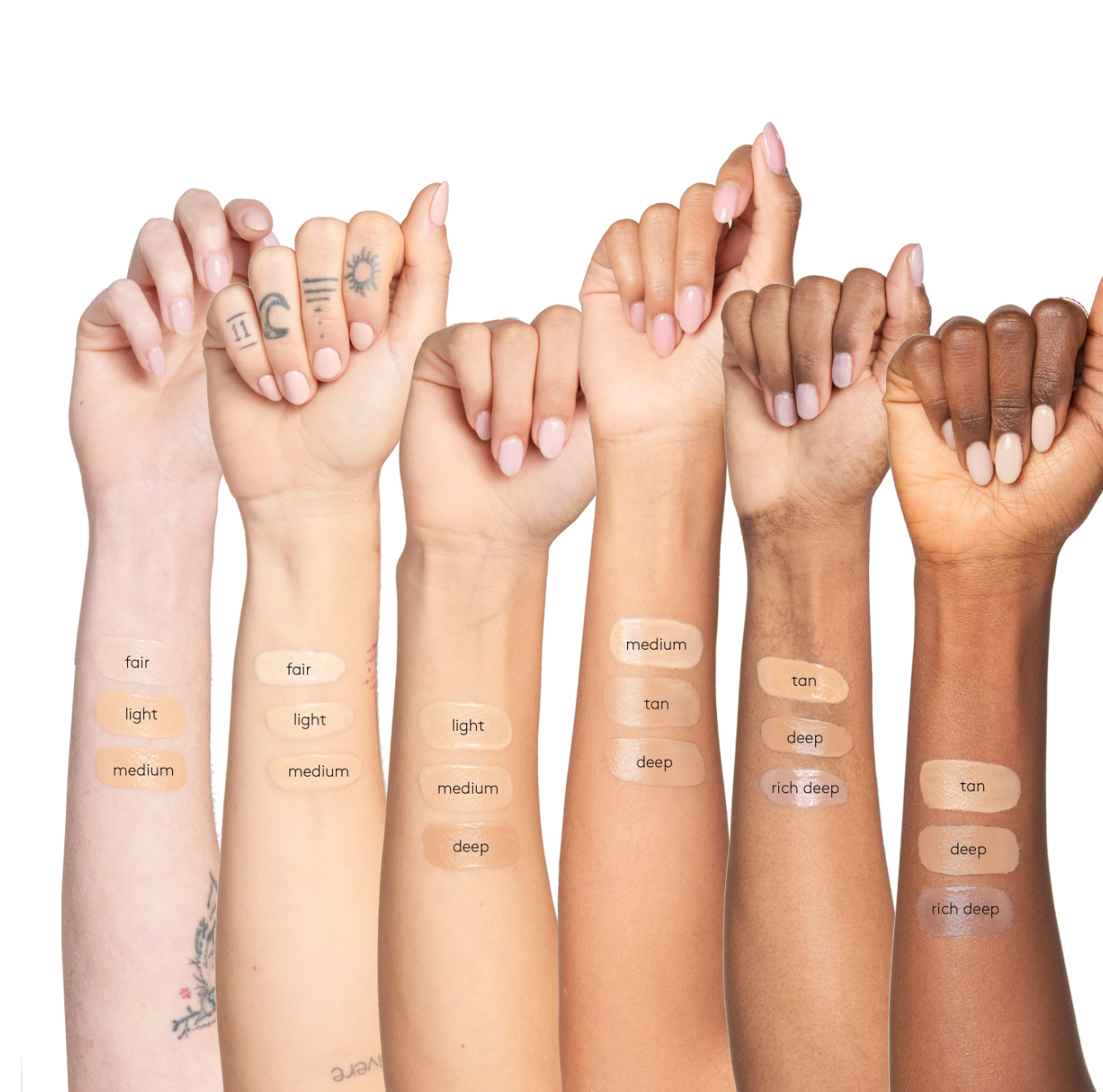 Hands with different skin tones displaying a range of makeup swatches.