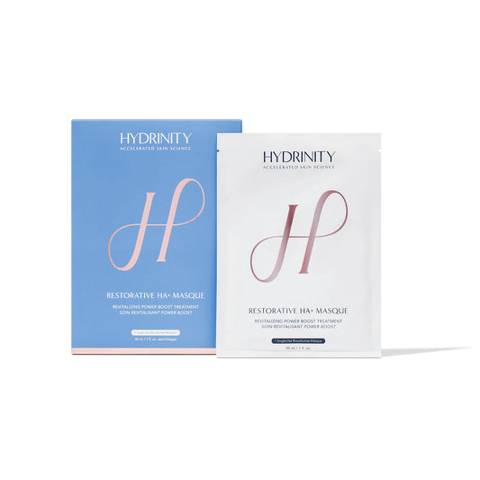 Two Hydrinity Restorative HA Masque packages, one blue and one white, on a white background.