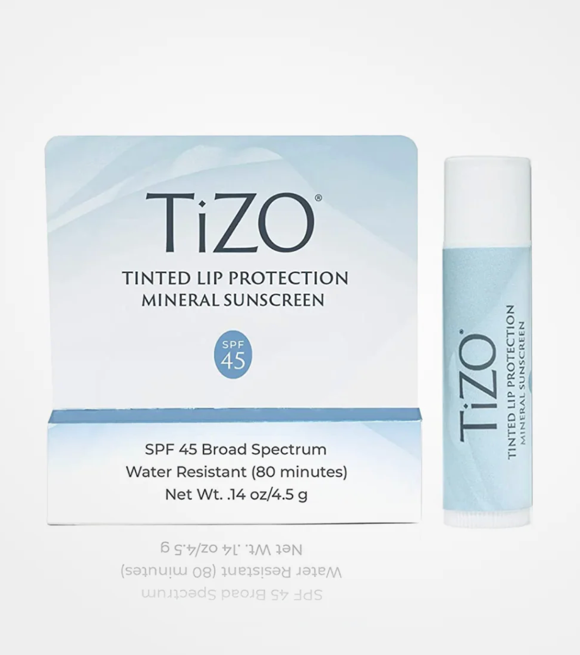 TiZO tinted lip protection mineral sunscreen packaging and bottle on a white background